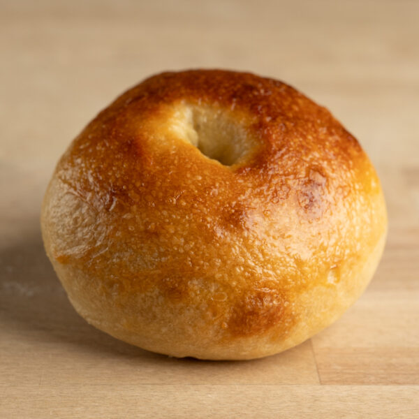 Close up of a browned plain bagel