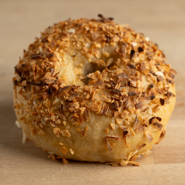 Close up of a garlic and onion bagel